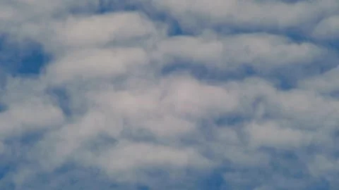 Soft White Clouds Drifting Across Blue Sky Background Видео 336844860