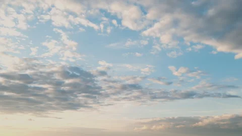 Soft white clouds float across the vast blue sky in this serene time-lapse 스톡 동영상 318940974