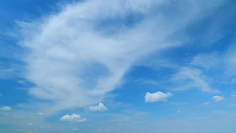 Soft white clouds moving on blue sky background. Tropical summer or spring Stock Footage 204973422