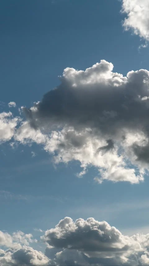 Soft White Clouds Over Blue Sky With Dramatic Light And Airy Summer Atmosphere Stock Footage 335661128