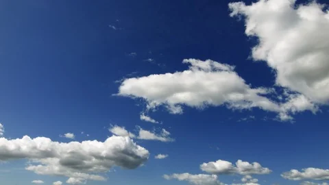 Soft white clouds slowly moving - Real Time Stock Footage 100747502