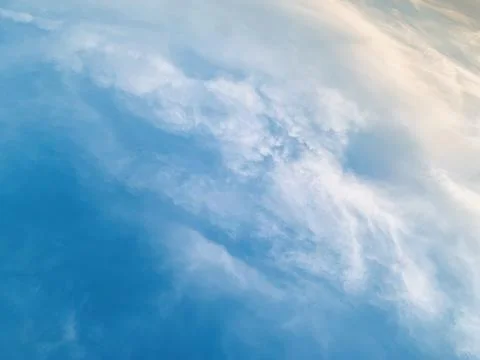 Soft White Clouds in Vibrant Blue Sky with Sun Glow Image Jakarta Indonesia Stock Photos