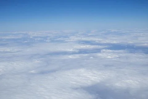 Soft White Clouds Viewed From Airplane Above The Sky During Flight Stock Photos