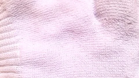 Soft white cotton fabric texture showing detailed knitted sweater weave patterns Stock Photos