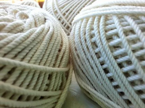 Soft white cotton thread roll with selective focus 스톡 사진