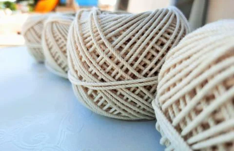 Soft white cotton thread roll with selective focus 스톡 사진