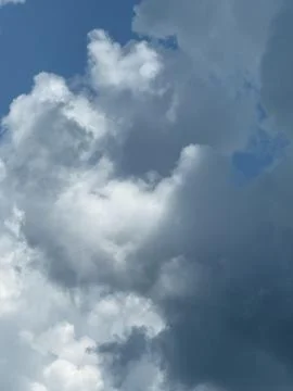 Soft White Cumulus Cloud with Dark Gray Underside Stock Photos