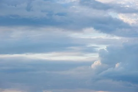 Soft White Cumulus Clouds Gathering Above Hazy Horizon Under Deep Blue Sky on Stock Photos