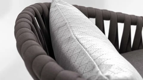 Soft white cushion rests on a beautiful designer chair. White background Видео 219314391