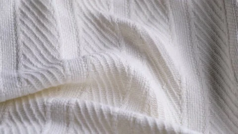 Soft white embossed striped fabric or plaid close-up fabric structure rotation Stock Footage 167167585