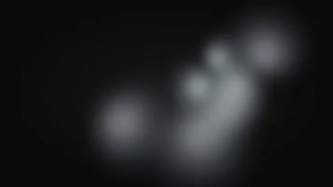 Soft white ethereal glowing light patches against a deep black background Video stock 335117334