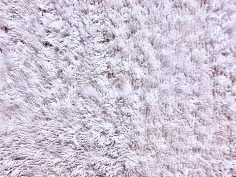 Soft white fluffy textile texture background with high pile fibers, cozy fabr Stock Photos