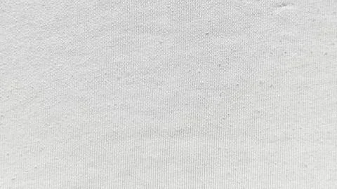 Soft white knit texture closeup cozy wool stitches fabric background, for wal Foto stock