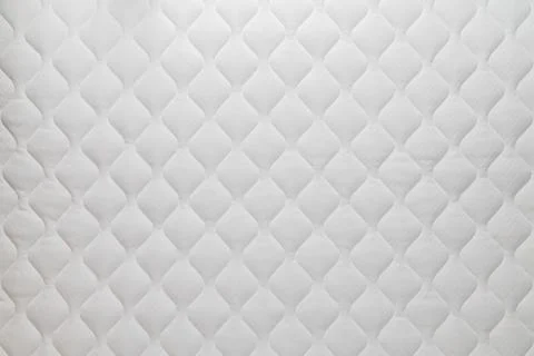Soft white mattress flat background and texture. Stock Photos