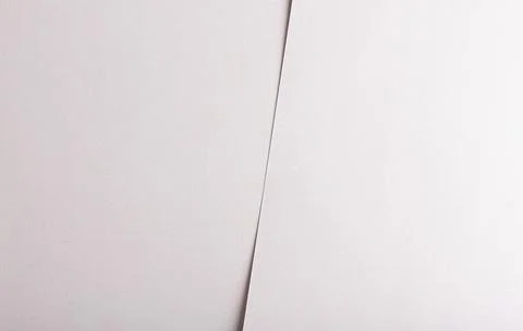 Soft white paper texture with a delicate fabric-like feel and subtle pearl-li Stock Photos