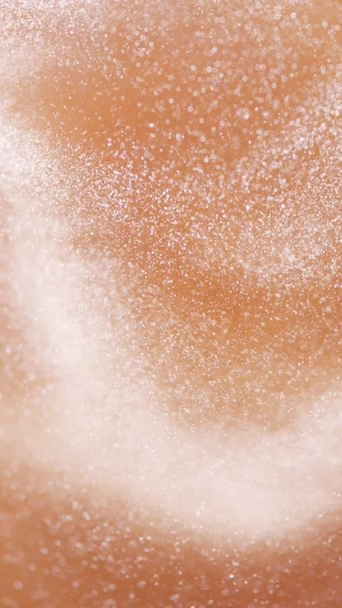 Soft white particles dancing elegantly, spinning across warm brown background Video stock 343938507