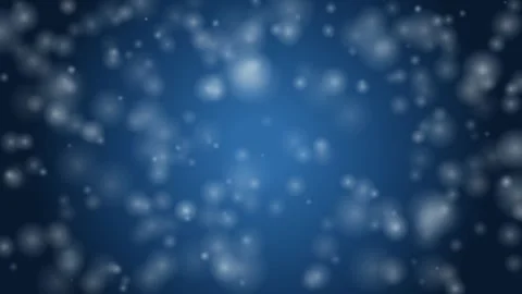 Soft white particles float gently against a dark blue gradient background, .. Stock Footage 346243740