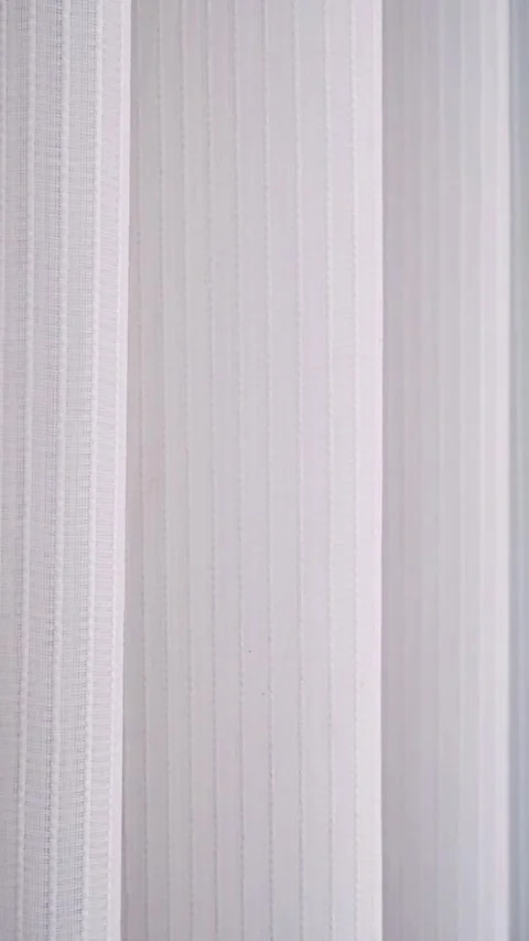 Soft white sheer curtains blowing gently in breeze.  Stock Footage 343551953