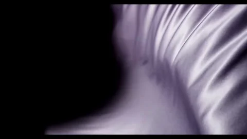 Soft white silk fabric flowing against a black background Stock Footage 329752149