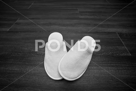 Soft white slippers Stock Photos