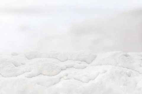 Soft white snow texture close-up with a blurred background, creating a mini.. Stock Illustration
