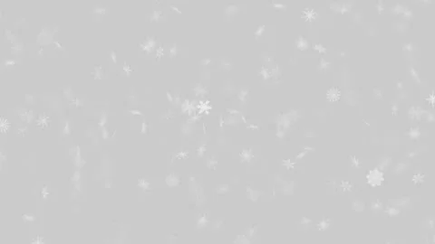 Soft white snowflakes falling gently on light grey winter background 動画素材 346243729