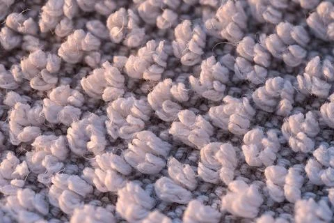 Soft white textured fabric surface with fluffy loops in warm macro detail Stock Photos