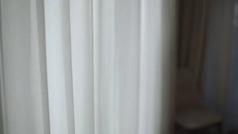 Soft white vertical curtains swaying on wind Stock Footage 329412209