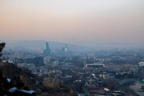 Soft winter light casts a dreamy glow over Tbilisi, highlighting the city's b Stock Photos