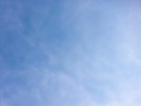 Soft Wispy Cloud Texture Spread Across a Blue Sky Stock Photos