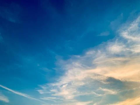 Soft Wispy Clouds in Blue Sky with Warm Golden Sunlight Image Jakarta Indonesia Stock Photos