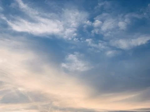 Soft Wispy Clouds in Blue Sky with Warm Golden Sunlight Image Jakarta Indonesia Stock Photos
