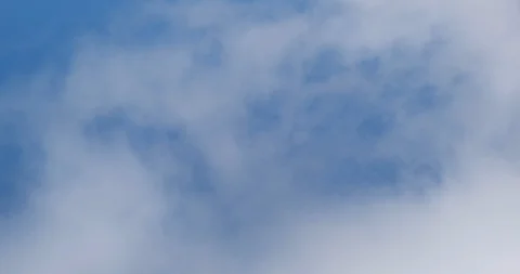 Soft, wispy clouds slowly moving right to left against blue sky. Stock Footage 128621616