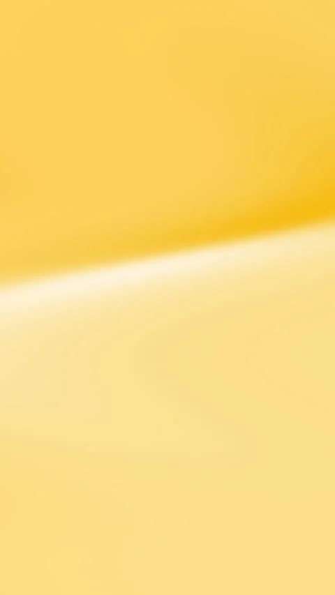 Soft Yellow Gradient Background with Subtle Light Ray Effect Stock Footage 327501124