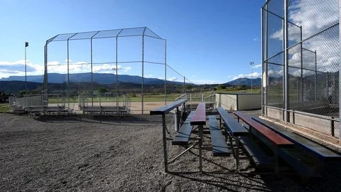 Softball fields in mountain town on a beautiful late afternoon, pan right. Stock-Footage 83426096