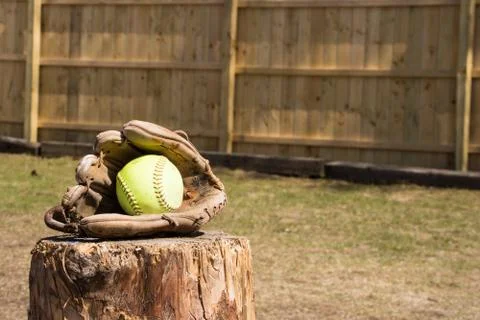Softball in glove Stock Photos