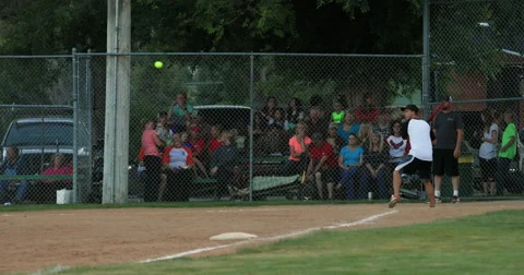 Softball man at home bat hit run rural community DCI 4K Stock Footage 64989676