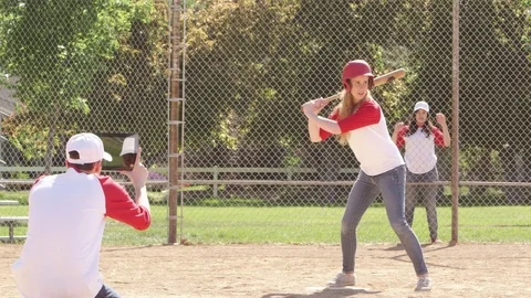 Softball player runs while friend records with tablet Stock-Footage 80133947