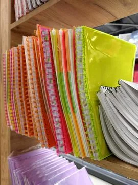 Softcover notebooks with spiral plastic bindings in a variety of colors, ne.. Stock Photos