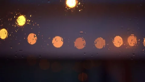 Softfocus lighting during rain drop on window Stock Footage 250952014