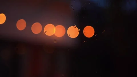 Softfocus lighting during rain drop on window Stock Footage 250952024