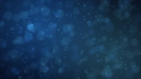 Softly blurred circular bokeh lights drift gently across a deep blue background Stock Footage 345184950