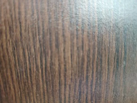 Softly blurred close-up of a wooden table surface showing warm wood grain a.. Stock Illustration