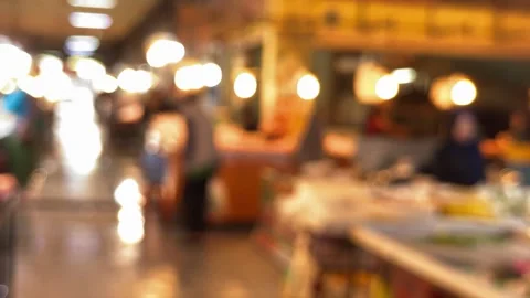Softly blurred marketplace lights create an enchanting visual symphony of m.. Video stock 337285125