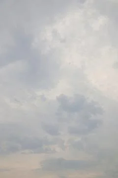 Softly diffused light through layered cumulus cloud formations overhead Stock Photos