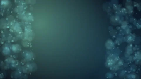 Softly glowing bokeh lights drift along the edges of a dark teal background 库存影片 345185640