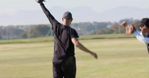 Softly rolling ball causing man diving headfirst to catch in glove, cheering Stock Footage 345070024