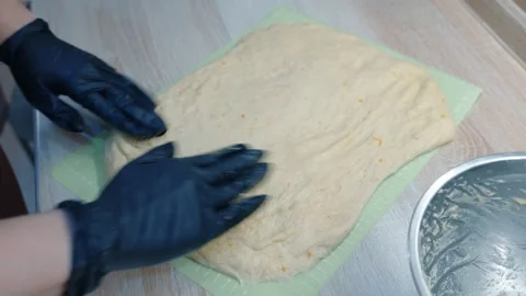 Softly Shaping Bread Dough With Gloves In Warm Bakery Setting Stock Footage 347318561