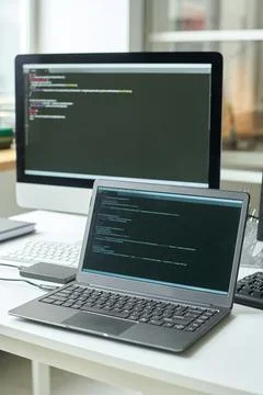 Software with codes on computers Stock Photos