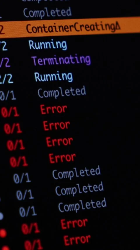 Software deployment status list on a dark monitor screen reflecting container Stock Footage 346526138